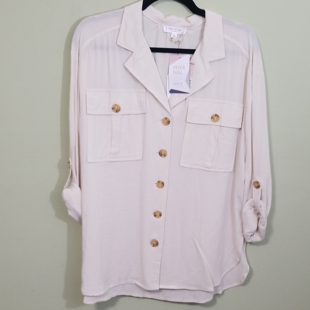 Shirt button up pockets on front.